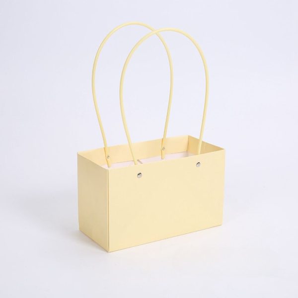 https://unikpackaging.com/wp-content/uploads/R243-lemon-color-flower-box-bag-waterproof-resistant-pink-trend-packaging-cajas-boxes-with-handles-korean-wrap-bouquet-arrangement-gift-florales-papel-600x600.jpg